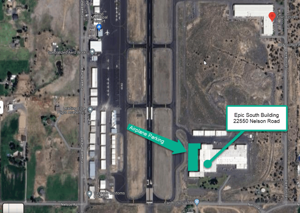 A satellite view of an airport with labels pointing to airplane parking and the Epic South Building at 22550 Nelson Road.